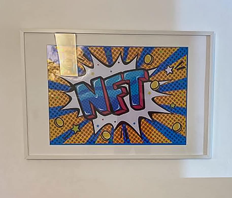 Framed image of text reading NFT in pop art style