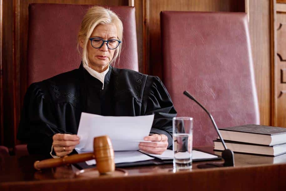 Judge looking skeptically at paperwork