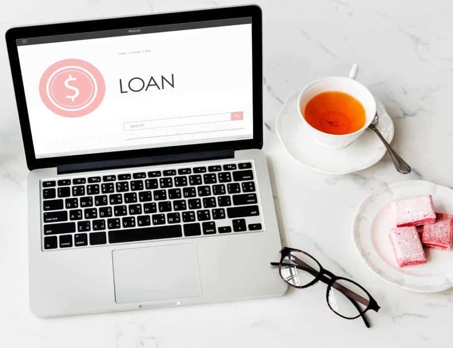 Laptop on a table with the word Loan on the screen